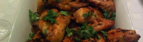 Curried glatt chicken wings coated in a sweet and spicy coconut-curry glaze
