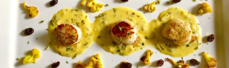 Sea Scallops with Saffron Cream Sauce, Turmeric-Dusted Cauliflower, and Buttered Raisins